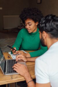 A Man and Woman Talking while Working Together